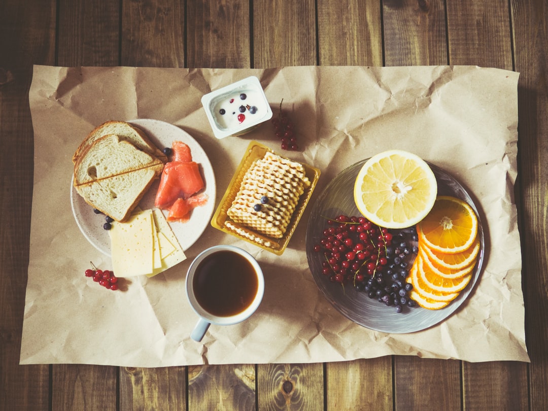 Photo by Anastasia Zhenina bread and fruits on plate